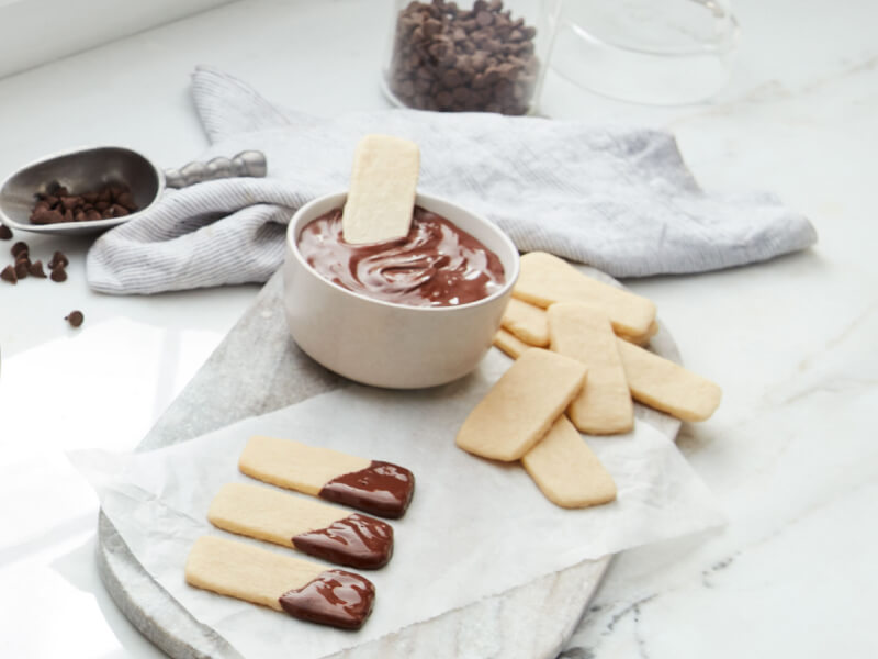 Baked sugar sticks dipped in ganache