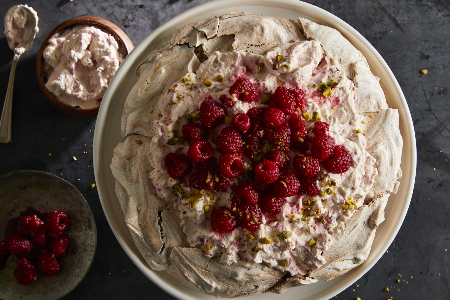 A chocolate pistachio pavlova with raspberry cream.