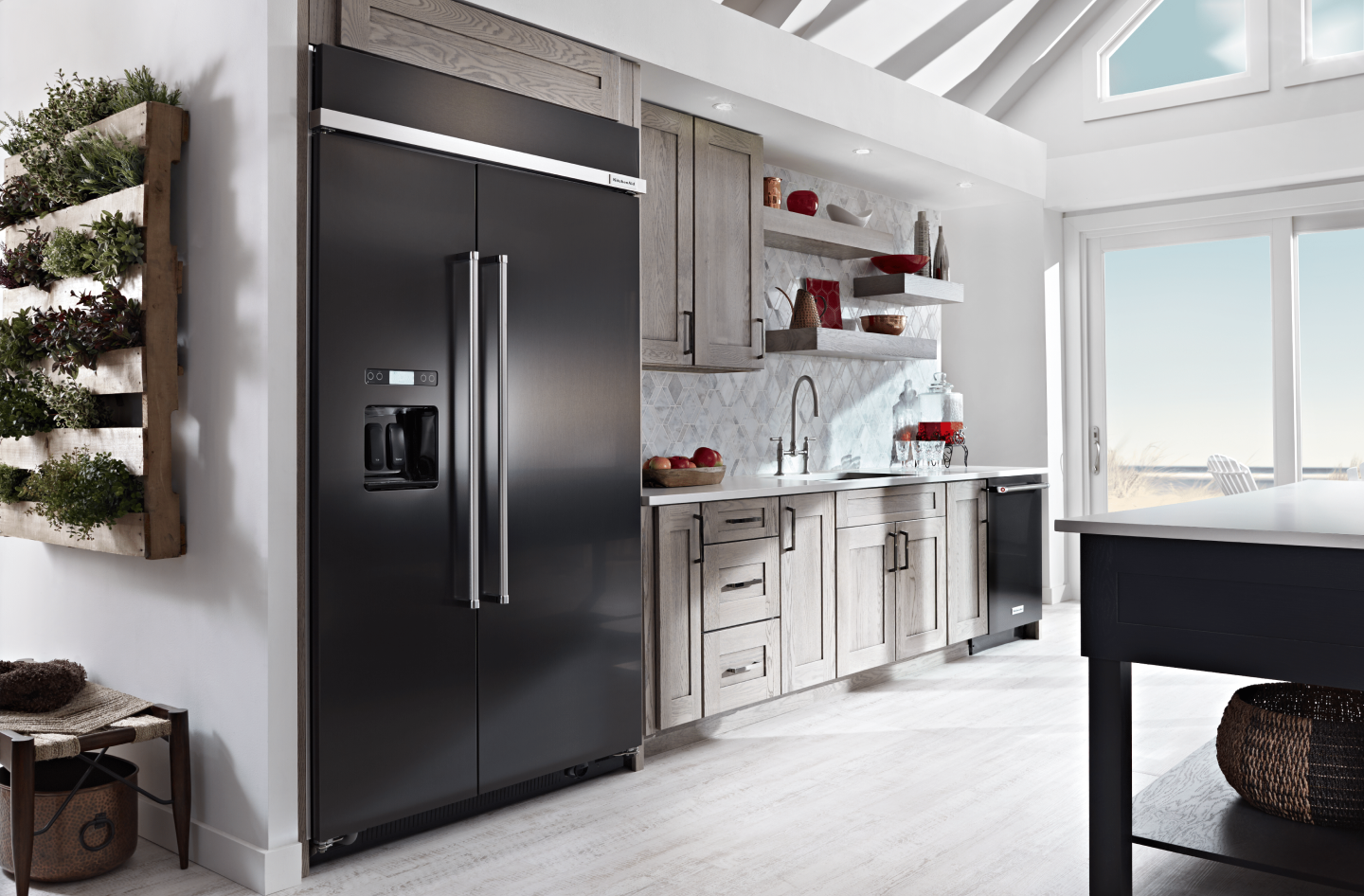 Black side-by-side refrigerator in small kitchen