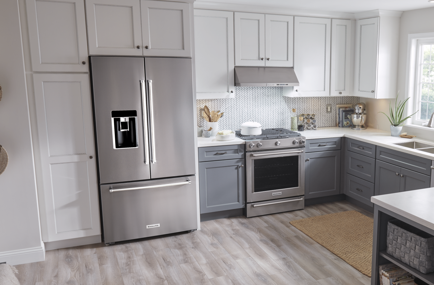 Stainless steel KitchenAid® french door refrigerator set in white cabinetry