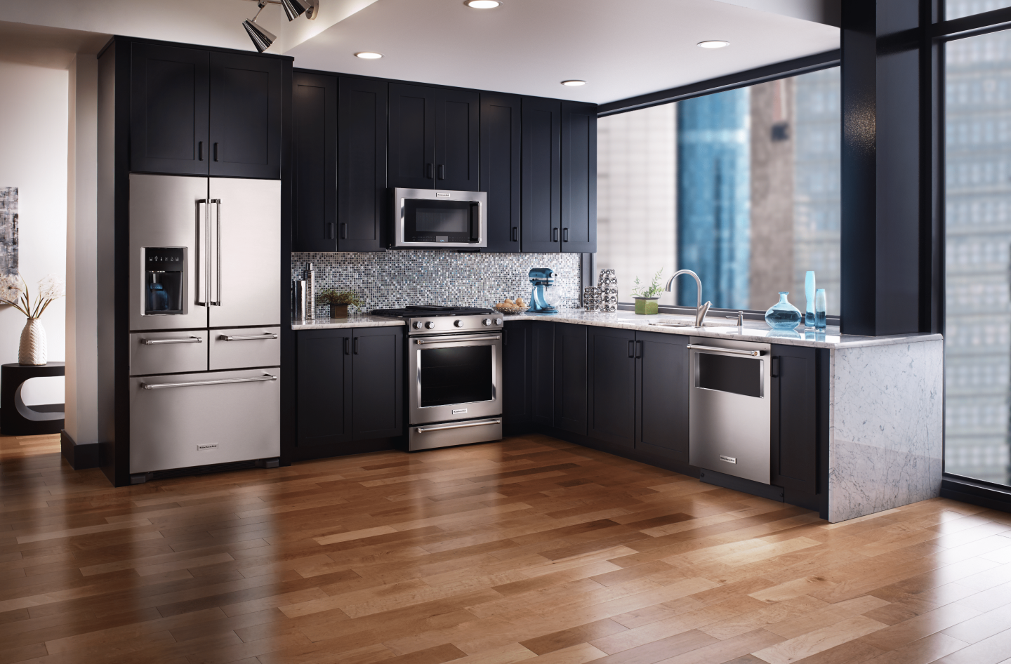Stainless steel refrigerator with bottom freezer in L-shaped kitchen