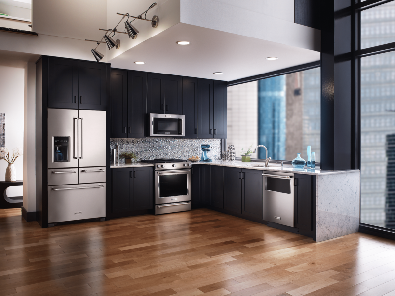 Stainless steel refrigerator with bottom freezer in L-shaped kitchen
