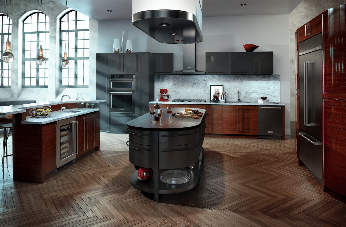 Built-in black refrigerator across from island in U-shaped kitchen