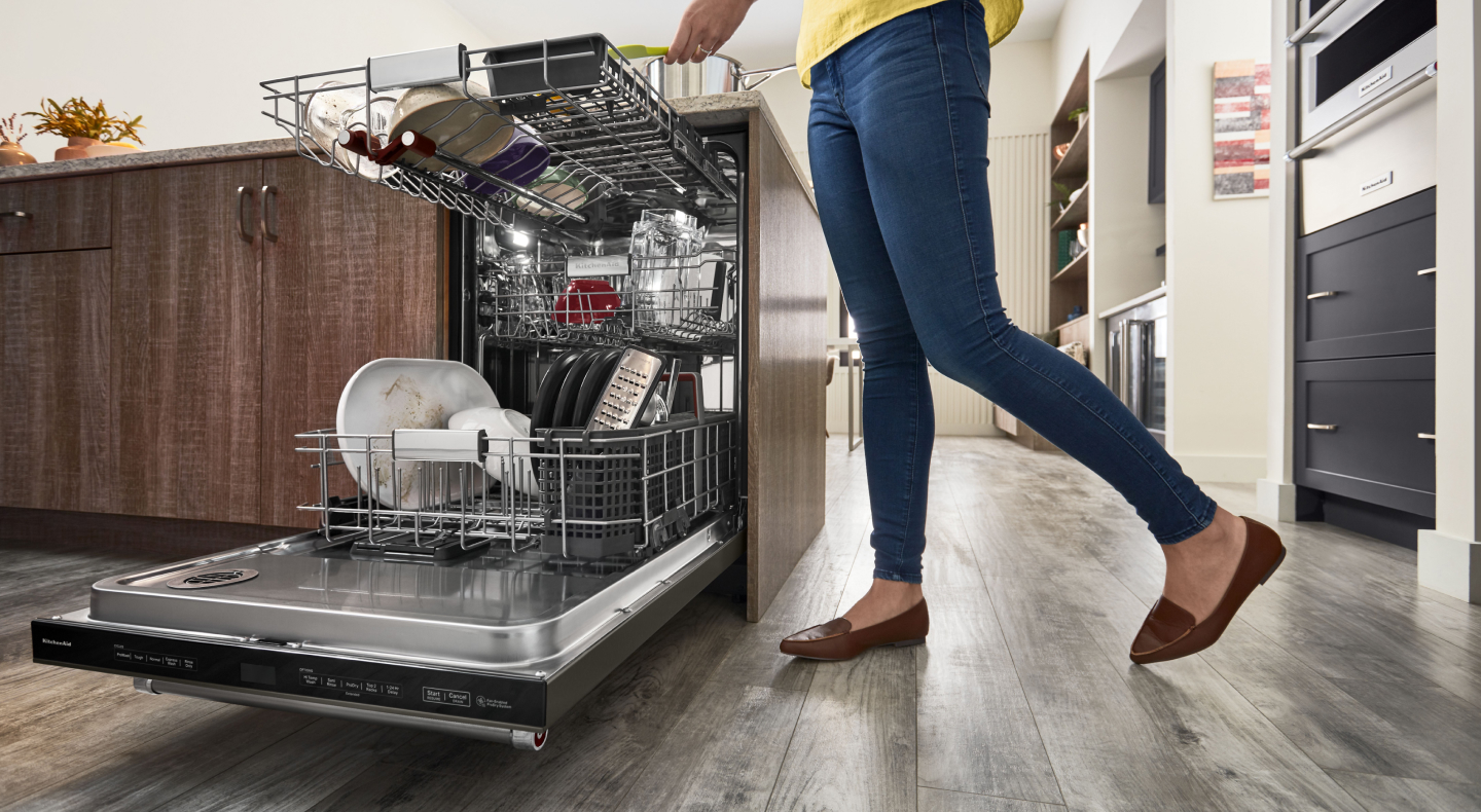 Person unloading dishwasher