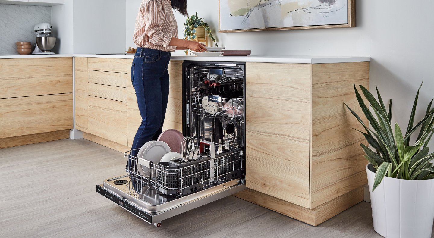 Person unloading dishwasher