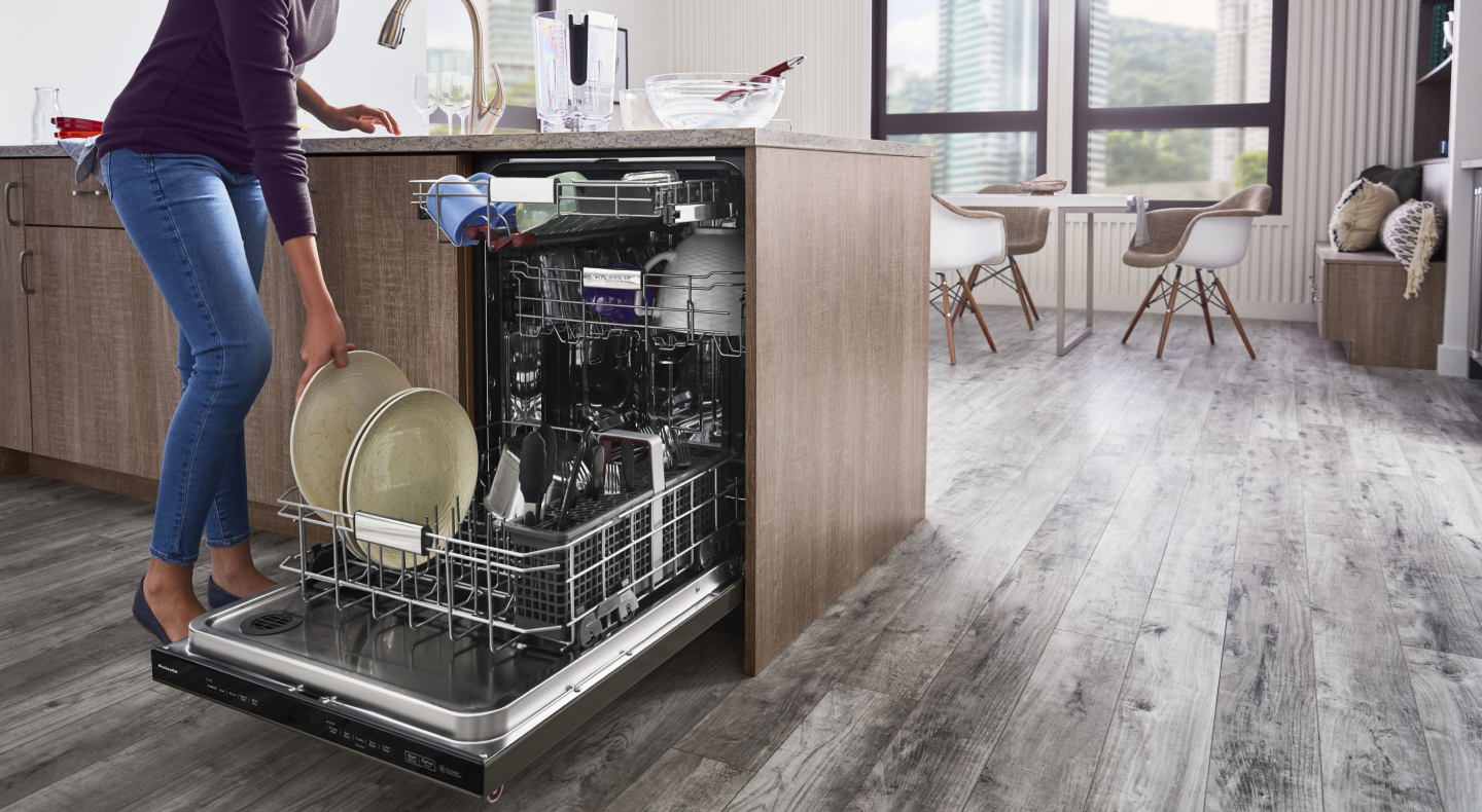 Person unloading dishwasher