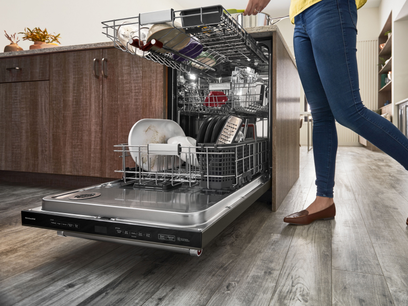 Person unloading dishwasher