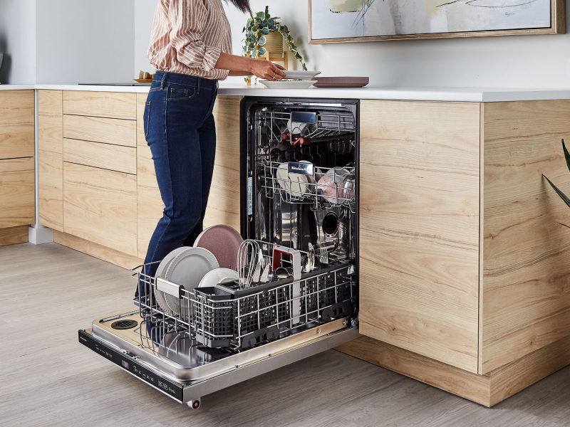 Person unloading dishwasher