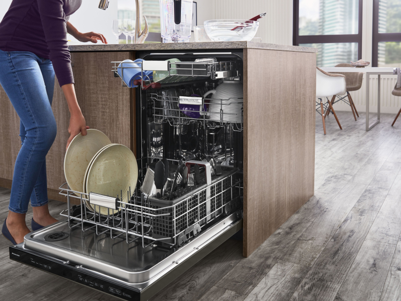 Person unloading dishwasher