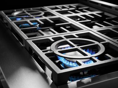 A closeup of a burner on a gas stove
