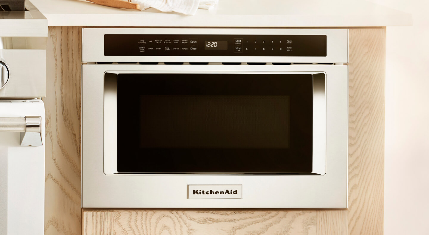 A KitchenAid® undercounter microwave in light cabinetry