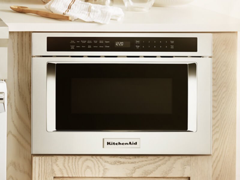 A KitchenAid® undercounter microwave in light cabinetry
