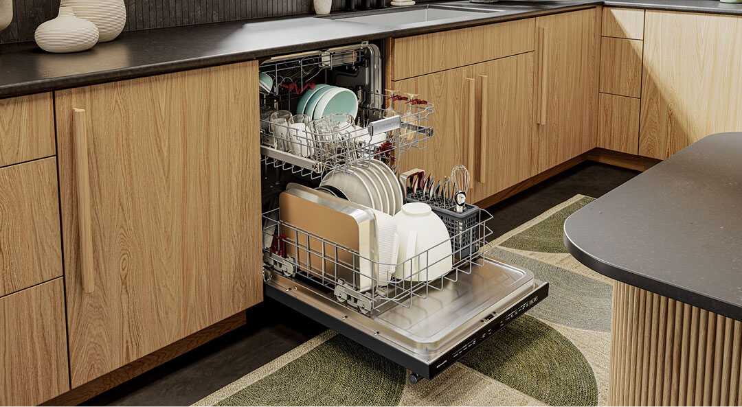 Open dishwasher filled with dishes and glassware