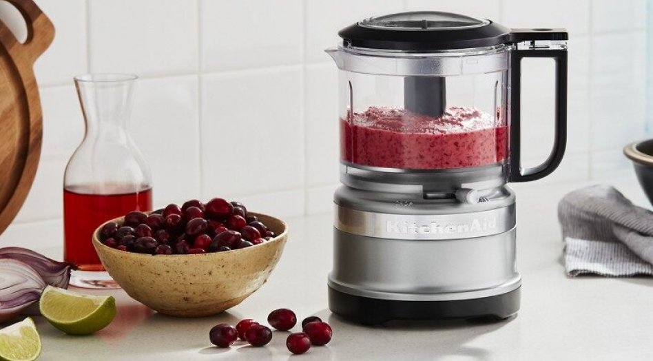 Food processor next to bowl of berries