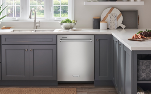 Silver KitchenAid® dishwasher in dark gray cabinetry