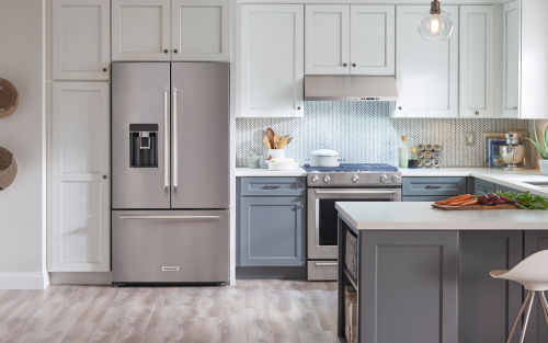 A stainless steel KitchenAid® French door refrigerator in a modern kitchen