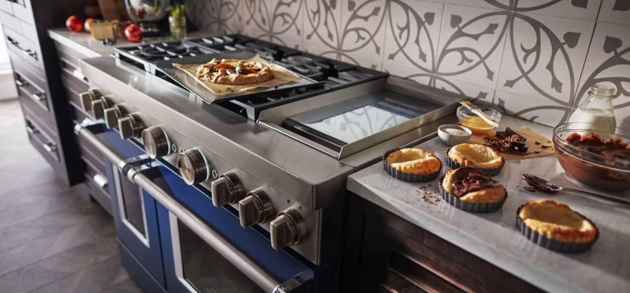 Commercial-style blue range with baked goods around