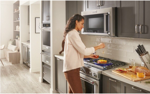 Person cooking on a gas cooktop