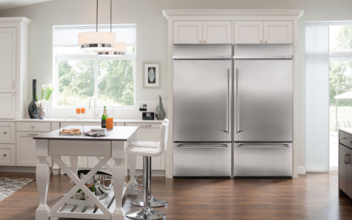 Stainless steel KitchenAid® refrigerator built into a modern kitchen