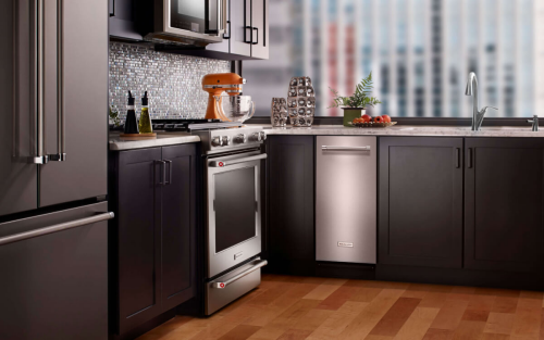 The interior of a kitchen with a KitchenAid® trash compactor