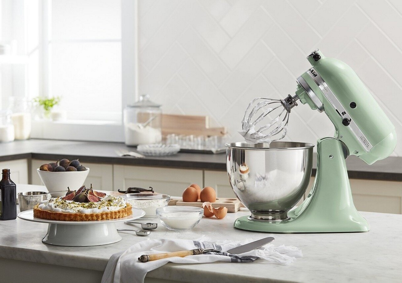 Green KitchenAid® stand mixer with whisk attached