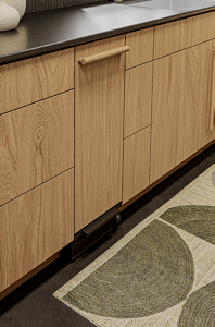 A panel-ready compactor fitted to match cabinetry.