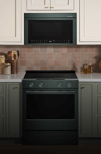 A KitchenAid® Over-the-Range microwave installed above a sleek, slide-in range
