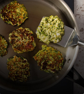 A person making food on a cooktop.