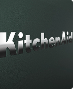 A close up of the embossed KitchenAid brand logo on the Juniper range.