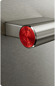A close up of the handle on a stainless steel oven.