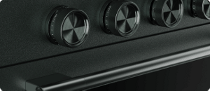 A close-up on the handle and knobs of a Juniper range.