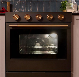 A closeup of the knobs of a KitchenAid® range