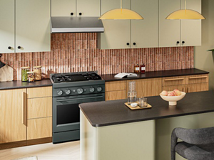 KitchenAid® range hood and gas range in a bohemian-style kitchen